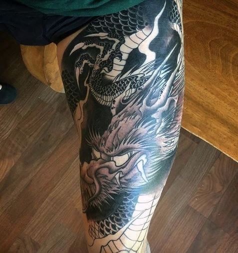 dragon thigh tattoo male